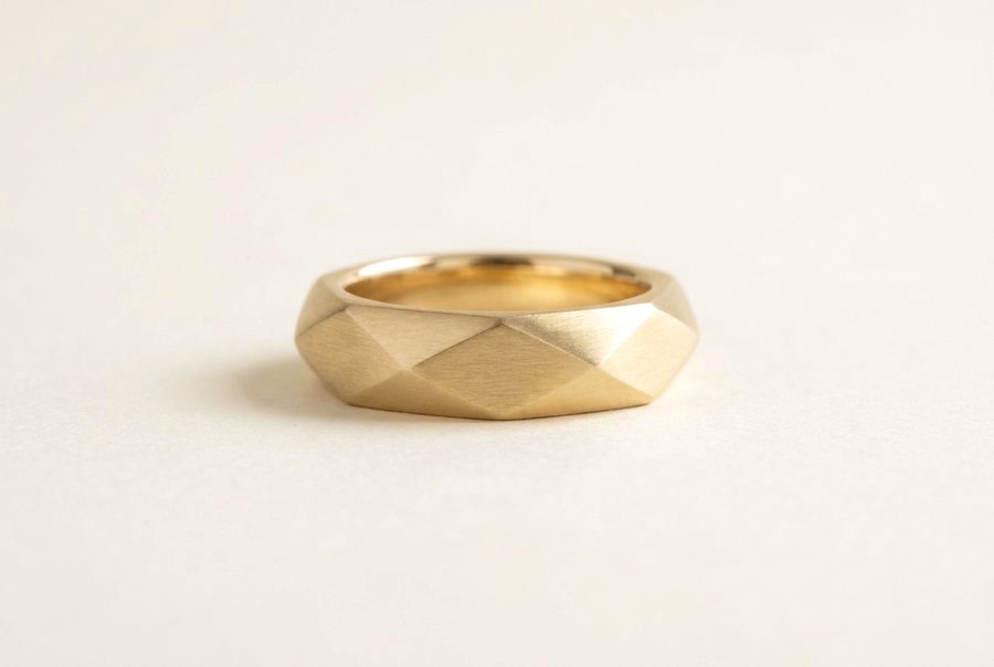 Faceted brushed yellow gold wedding band