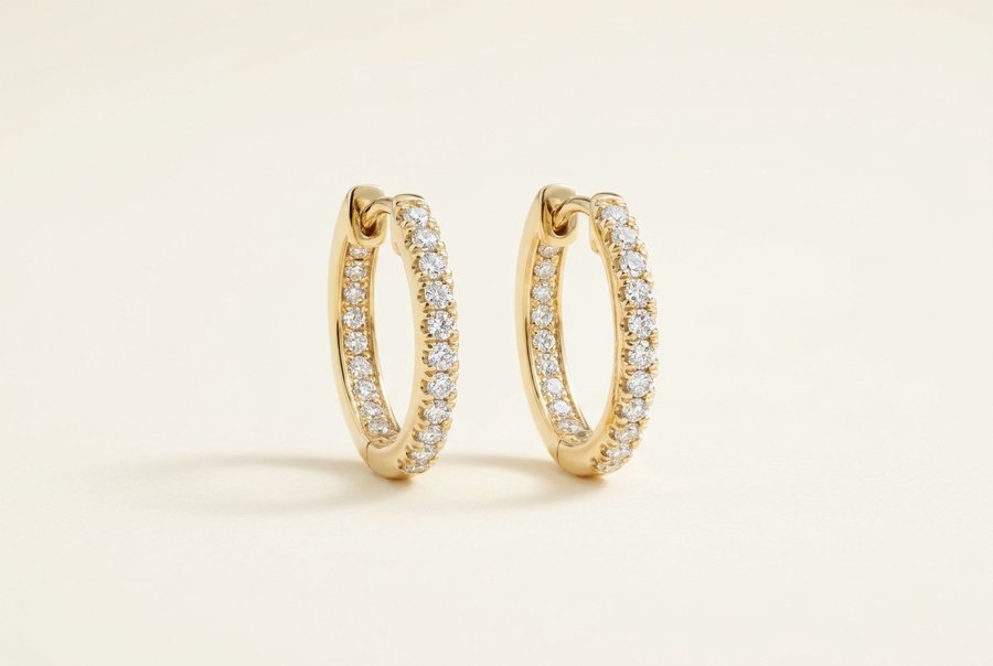Yellow gold hoops set with pave diamonds