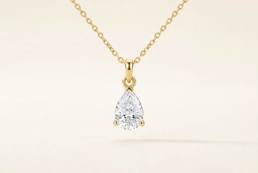 Pear diamond pendant on a yellow gold chain