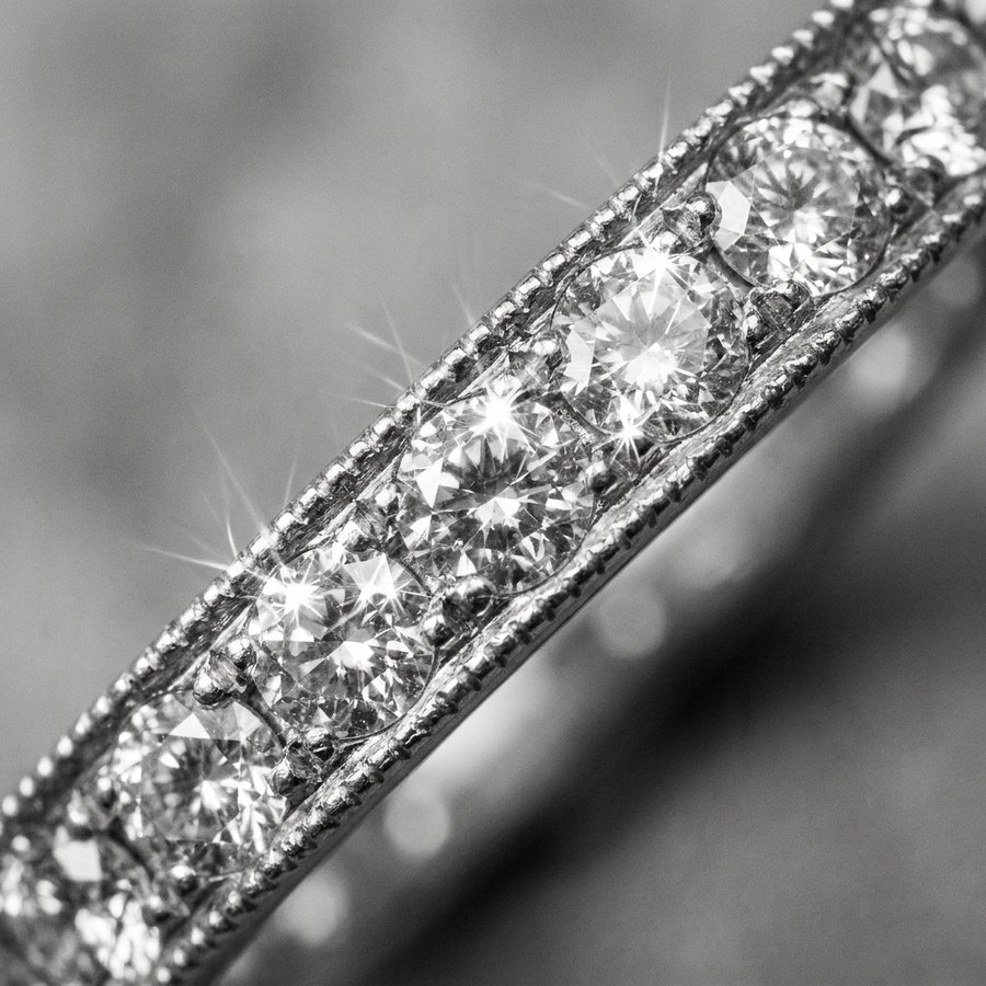 A milgrain diamond band in close detail